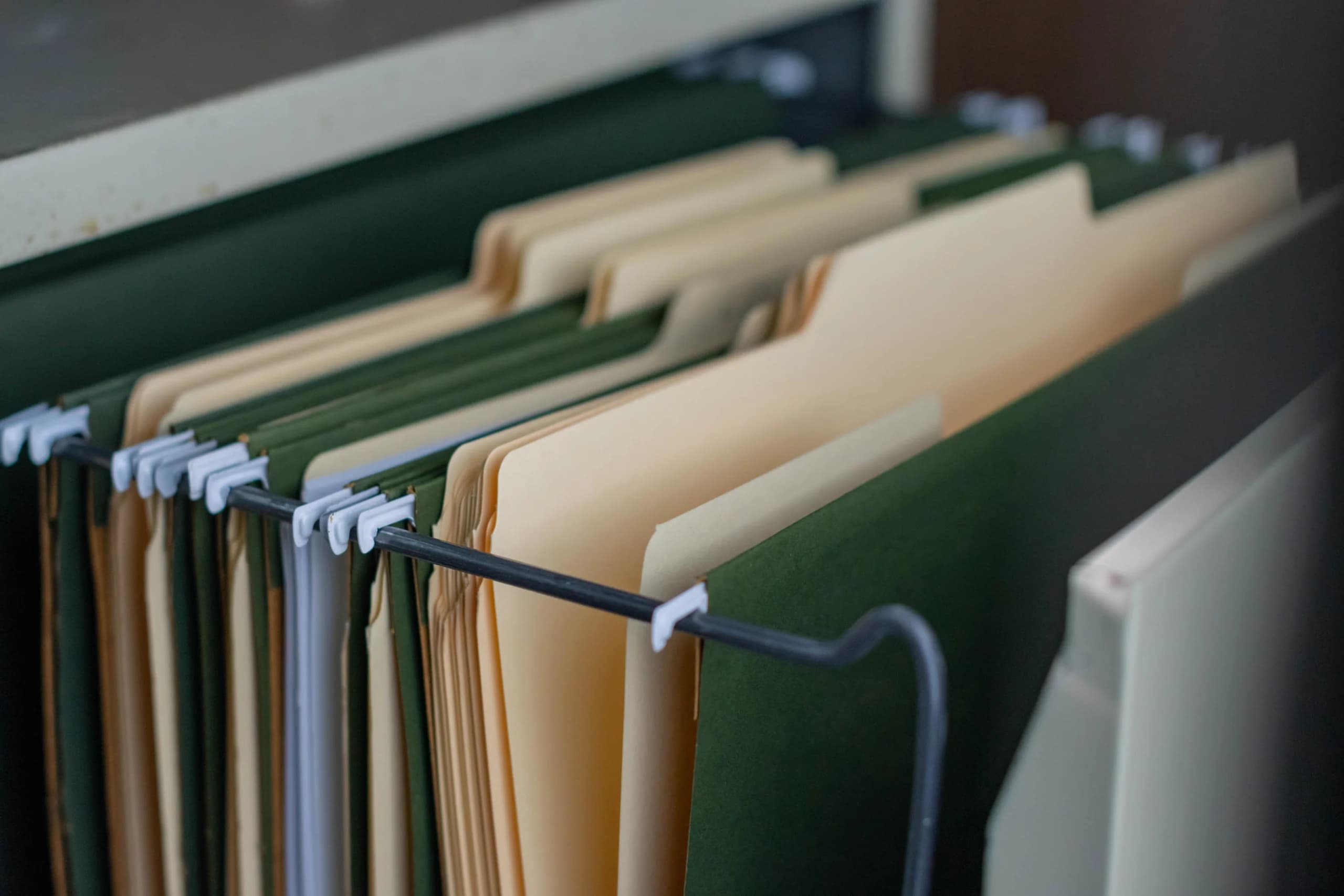 Organized business folders and documents representing Falcon Sánchez brochures