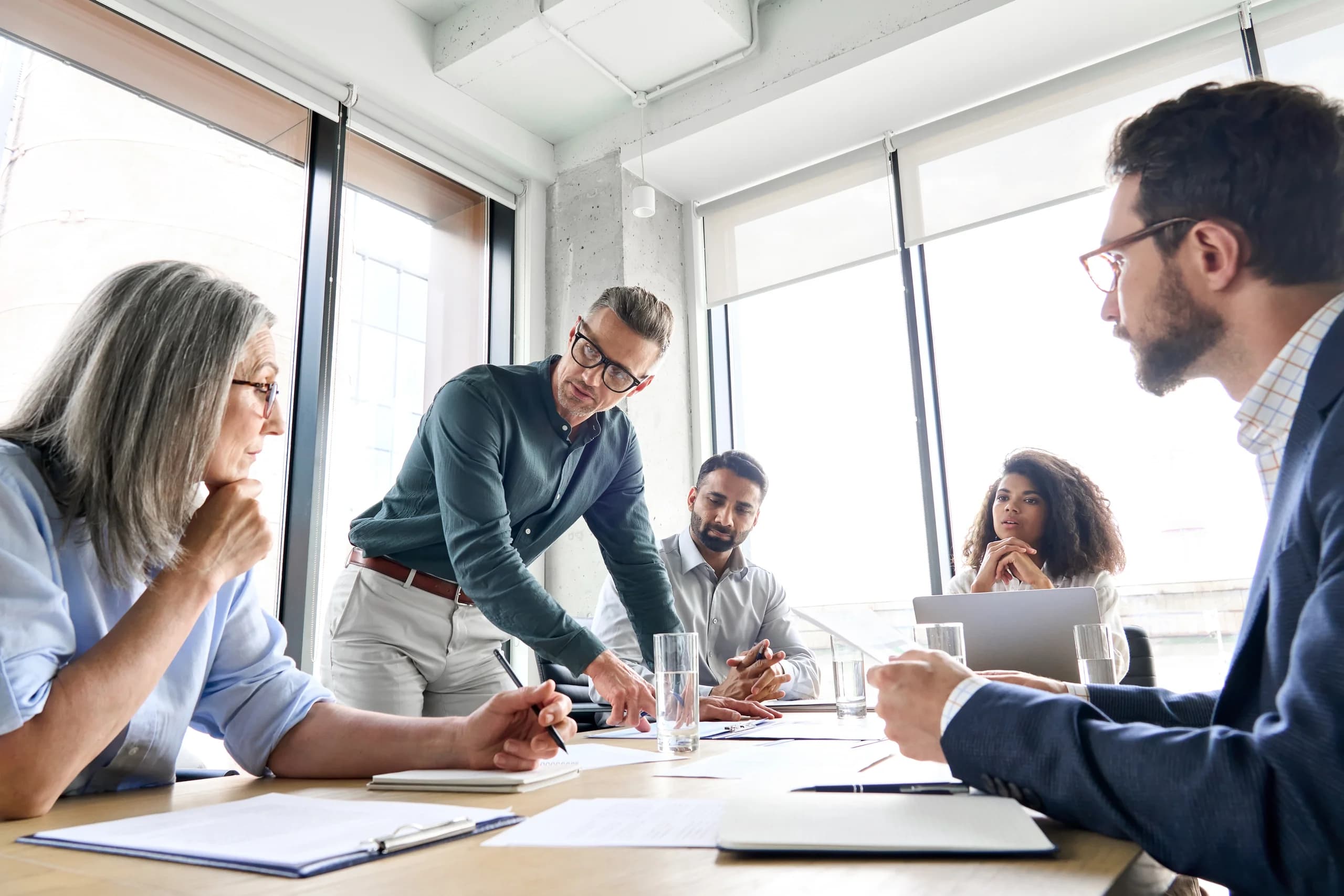 Professionals reviewing tax planning documents in a meeting